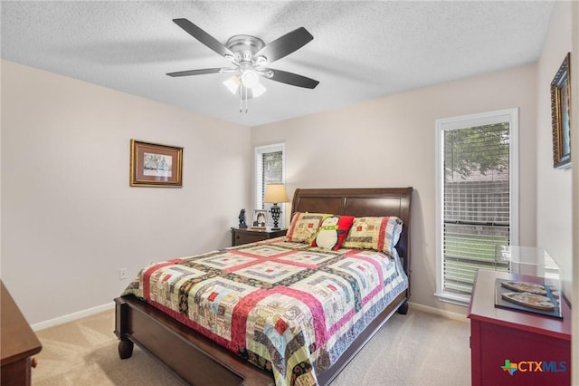 106 Westbrook Dr, Victoria, TX 77904 - carpeted bedroom featuring a textured ceiling and a ceiling fan