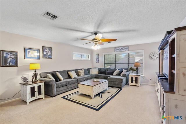 106 Westbrook Dr, Victoria, TX 77904 - living room with ceiling fan, light carpet, and a textured ceiling