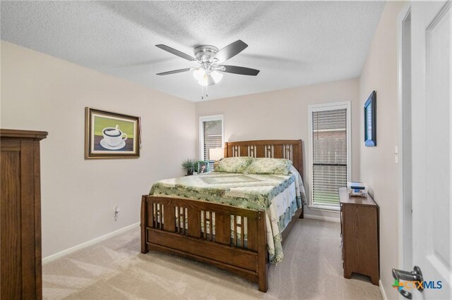 106 Westbrook Dr, Victoria, TX 77904 - bedroom featuring carpet floors, a textured ceiling, and a ceiling fan