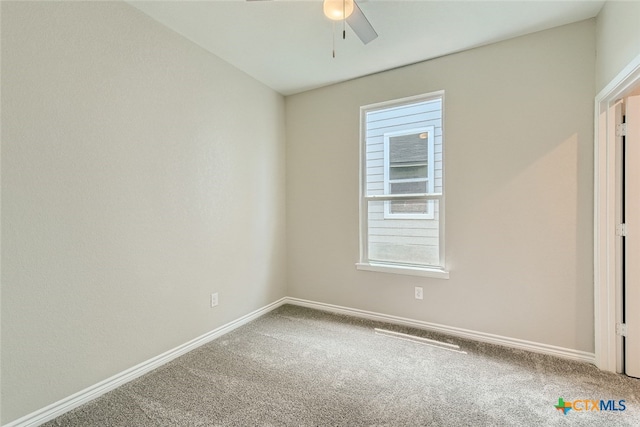 unfurnished room with ceiling fan and carpet floors