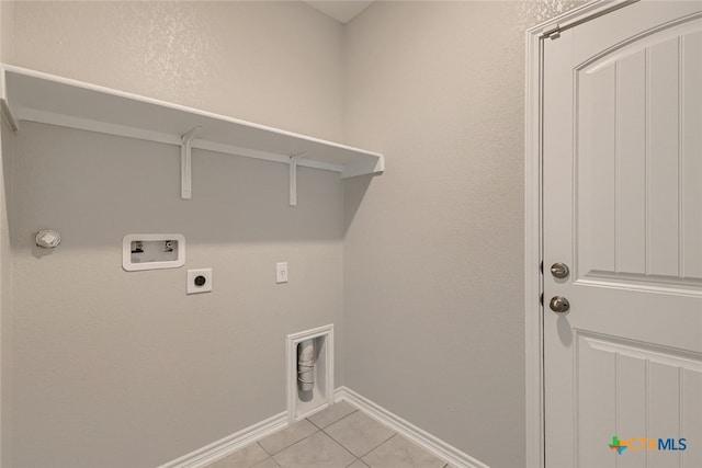 washroom with washer hookup, light tile patterned floors, and electric dryer hookup