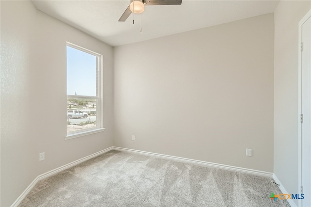 carpeted empty room with ceiling fan