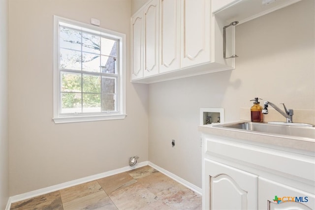 washroom featuring washer hookup, electric dryer hookup, cabinets, and sink