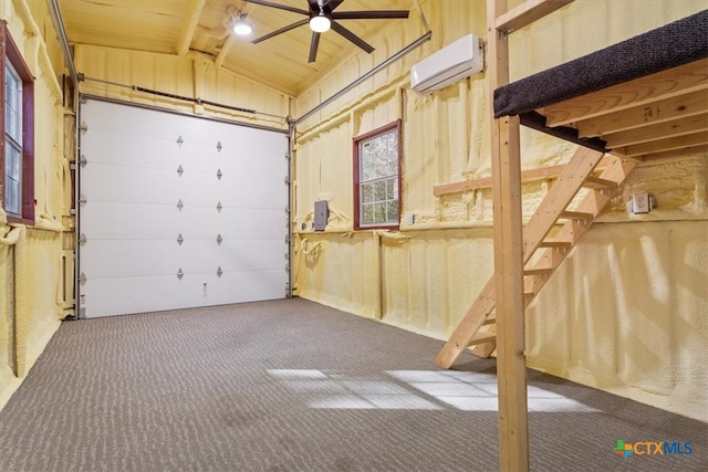 garage with a wall mounted AC and ceiling fan