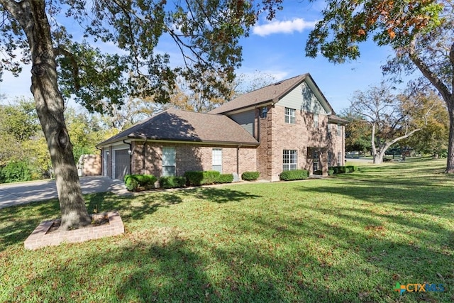 view of side of property with a garage and a lawn