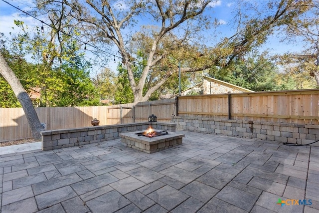 view of patio / terrace featuring a fire pit