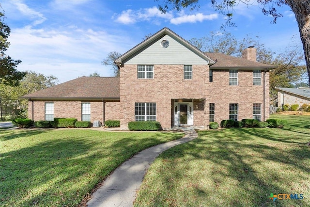 view of front of house with a front lawn