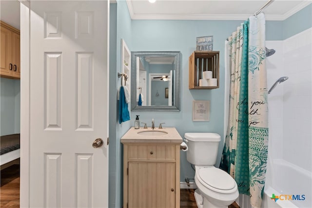 full bathroom featuring shower / bath combination with curtain, crown molding, vanity, hardwood / wood-style floors, and toilet