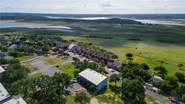 drone / aerial view with a rural view and a water view