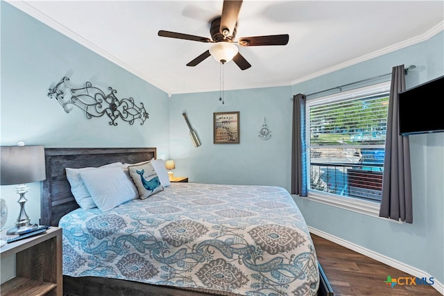 bedroom featuring ceiling fan, dark hardwood / wood-style floors, and ornamental molding