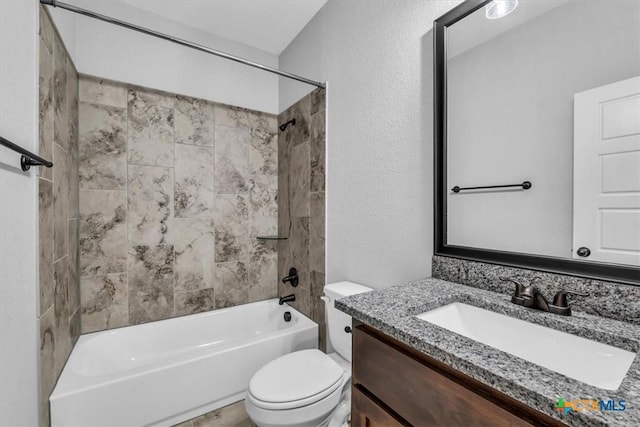 full bath with shower / bath combination, a textured wall, toilet, and vanity