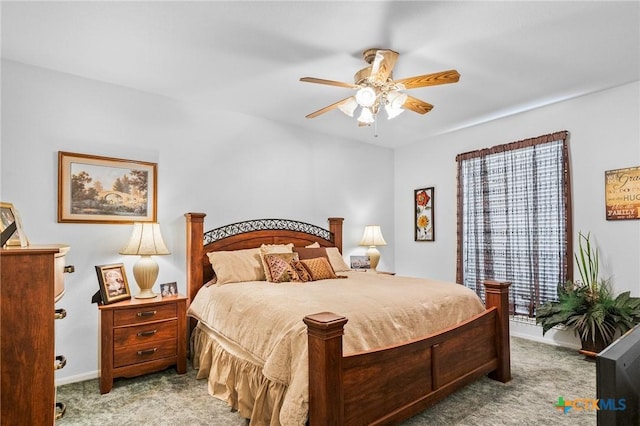 bedroom featuring baseboards, carpet, and ceiling fan