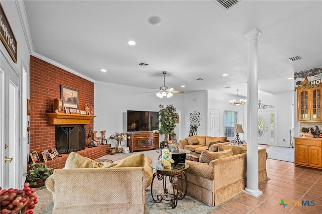 living room with recessed lighting, tile patterned flooring, visible vents, decorative columns, and a fireplace