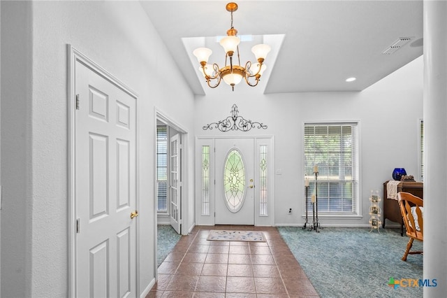tiled entryway featuring recessed lighting, carpet, an inviting chandelier, visible vents, and baseboards