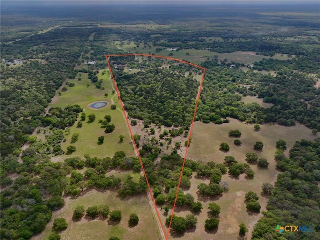 birds eye view of property with a rural view