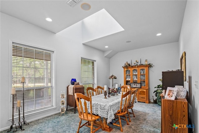 dining area with a healthy amount of sunlight, carpet flooring, and recessed lighting