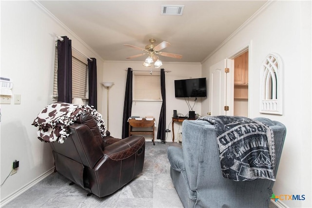 living area with a ceiling fan, visible vents, ornamental molding, and baseboards