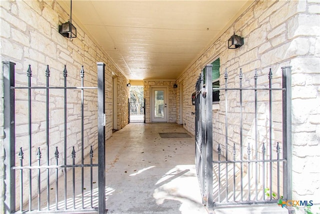 exterior space with stone siding