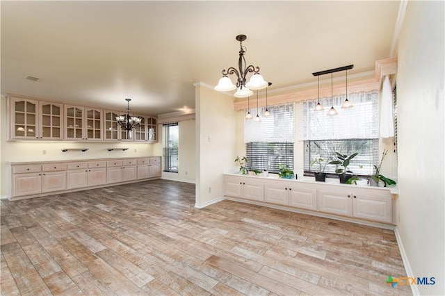 mudroom with light wood-type flooring, visible vents, baseboards, and an inviting chandelier