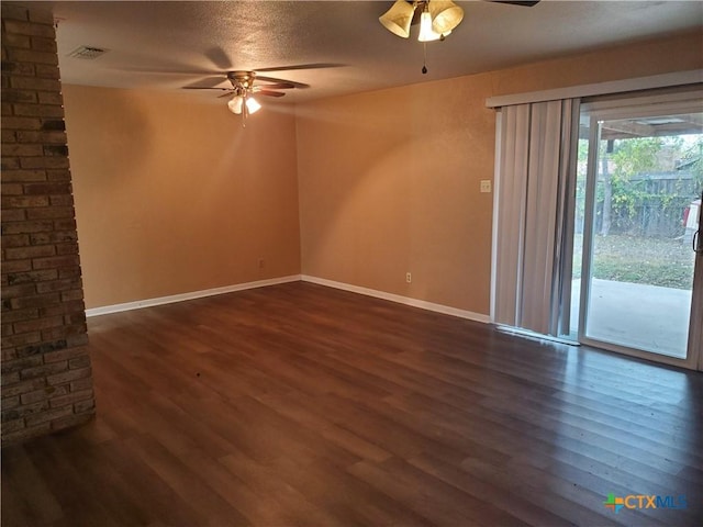 unfurnished room featuring ceiling fan, a textured ceiling, and dark hardwood / wood-style flooring