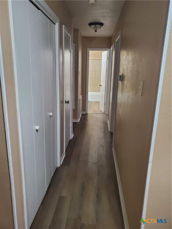 hallway featuring hardwood / wood-style floors