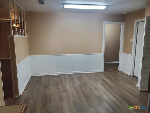 empty room featuring hardwood / wood-style floors