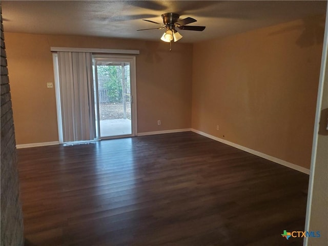 unfurnished room featuring ceiling fan and dark hardwood / wood-style floors