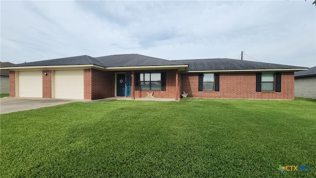 view of front of house with a garage and a front lawn