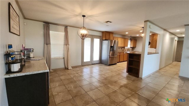 kitchen featuring french doors, stainless steel refrigerator with ice dispenser, light tile patterned floors, ornamental molding, and decorative light fixtures