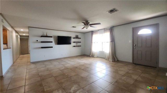 tiled entrance foyer featuring ceiling fan