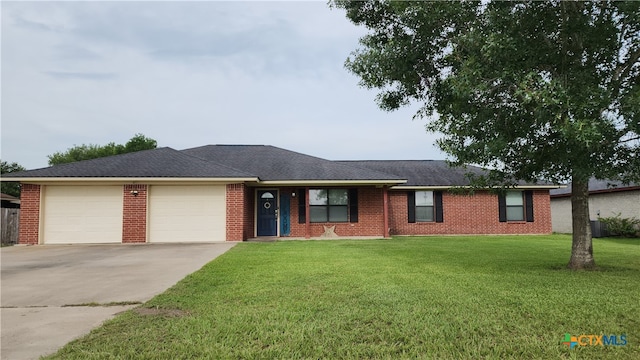 ranch-style house featuring a front lawn and a garage