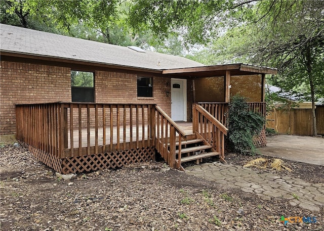 view of front facade with a wooden deck