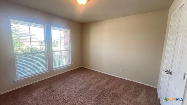 5711 Stonehaven Dr, Temple, TX 76502 - empty room featuring dark carpet and baseboards