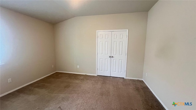 5711 Stonehaven Dr, Temple, TX 76502 - unfurnished bedroom featuring carpet floors, lofted ceiling, and a closet