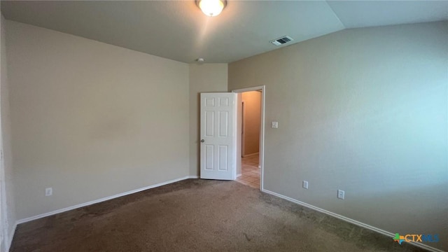 5711 Stonehaven Dr, Temple, TX 76502 - spare room with carpet flooring and vaulted ceiling