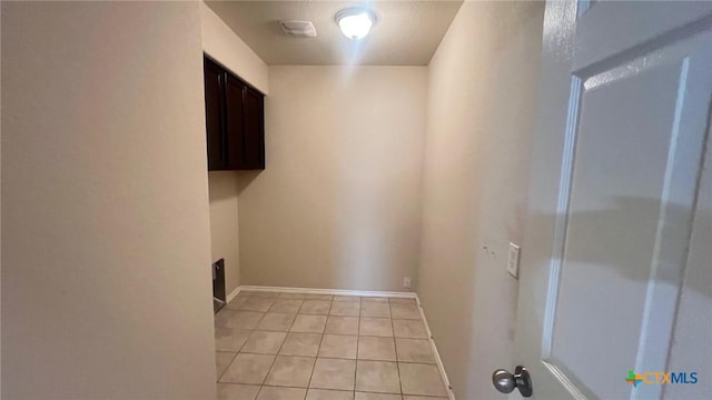 5711 Stonehaven Dr, Temple, TX 76502 - laundry area with light tile patterned floors and baseboards