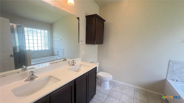5711 Stonehaven Dr, Temple, TX 76502 - full bath featuring a garden tub, double vanity, tile patterned floors, and an enclosed shower