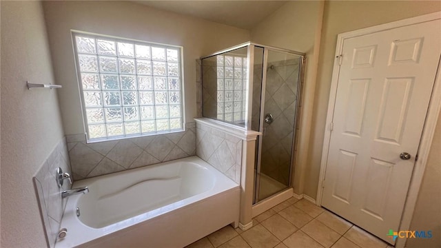5711 Stonehaven Dr, Temple, TX 76502 - full bathroom featuring tile patterned flooring, a bath, and a stall shower