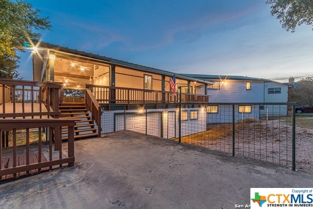 view of front of home featuring a wooden deck