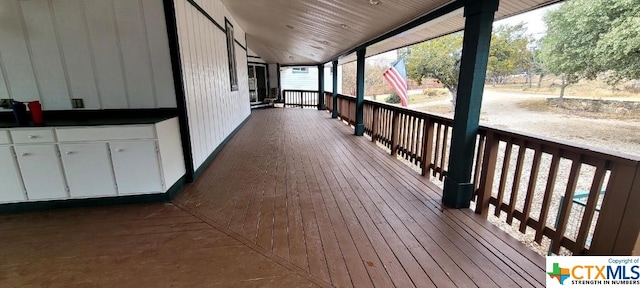 wooden terrace featuring a porch