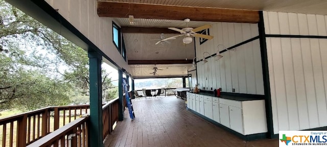 exterior space featuring ceiling fan