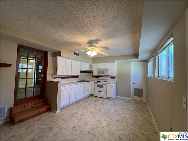 kitchen with white cabinetry, sink, ceiling fan, a textured ceiling, and white appliances