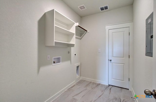 3625 Meteor Rd, New Braunfels, TX 78130 - laundry room with electric dryer hookup, gas dryer hookup, hookup for a washing machine, electric panel, and light marble finish floors