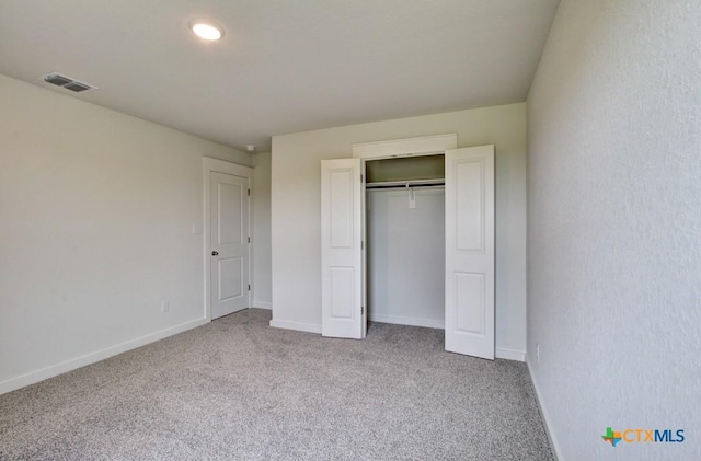 3625 Meteor Rd, New Braunfels, TX 78130 - unfurnished bedroom with carpet flooring, baseboards, and a closet