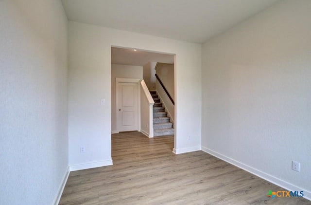 3625 Meteor Rd, New Braunfels, TX 78130 - empty room featuring light wood finished floors, stairs, and baseboards