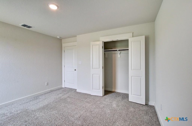 3625 Meteor Rd, New Braunfels, TX 78130 - unfurnished bedroom featuring carpet flooring, a closet, and baseboards