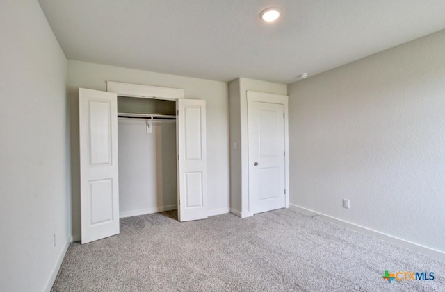 3625 Meteor Rd, New Braunfels, TX 78130 - unfurnished bedroom with carpet floors, baseboards, and a closet
