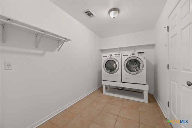 16503 Lounsbury Pl, Austin, TX 78717 - laundry room featuring washing machine and clothes dryer and light tile patterned floors