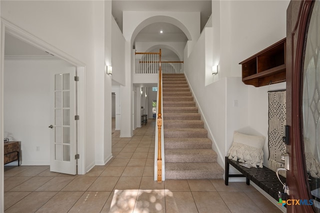 16503 Lounsbury Pl, Austin, TX 78717 - staircase with a towering ceiling and tile patterned flooring