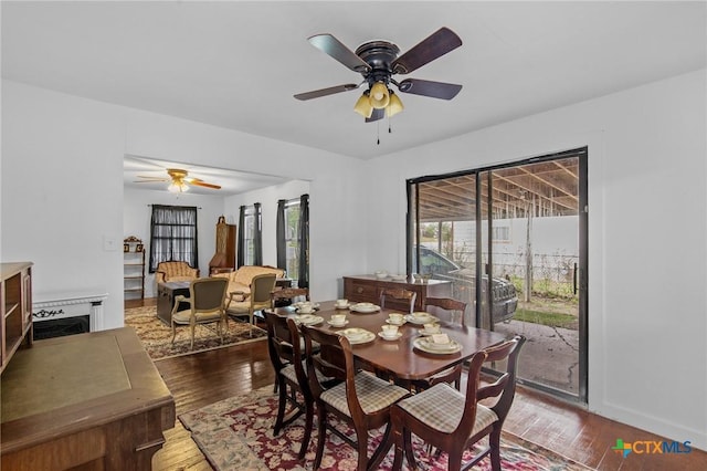 409 E Empresario St, Refugio, TX 78377 - dining space featuring a ceiling fan and dark wood-style flooring